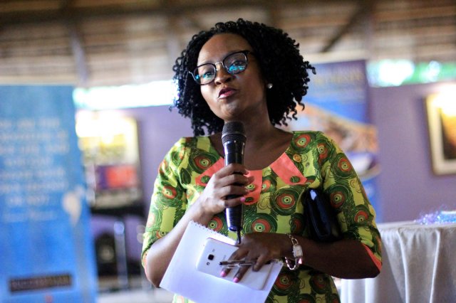 Jackee Batanda the host of the event speaking about SuccessSpark services